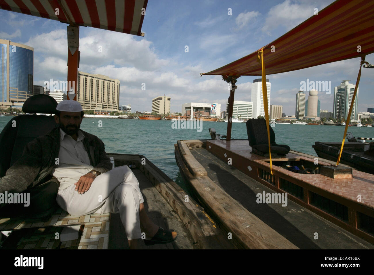 Man sitting on boat dubai hi-res stock photography and images - Alamy