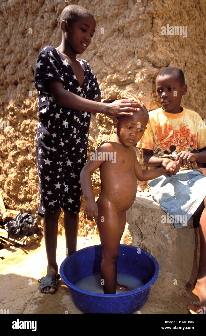 Rwanda genocide victim orphan Sophia age 14 is mother to her younger siblings Stock Photo
