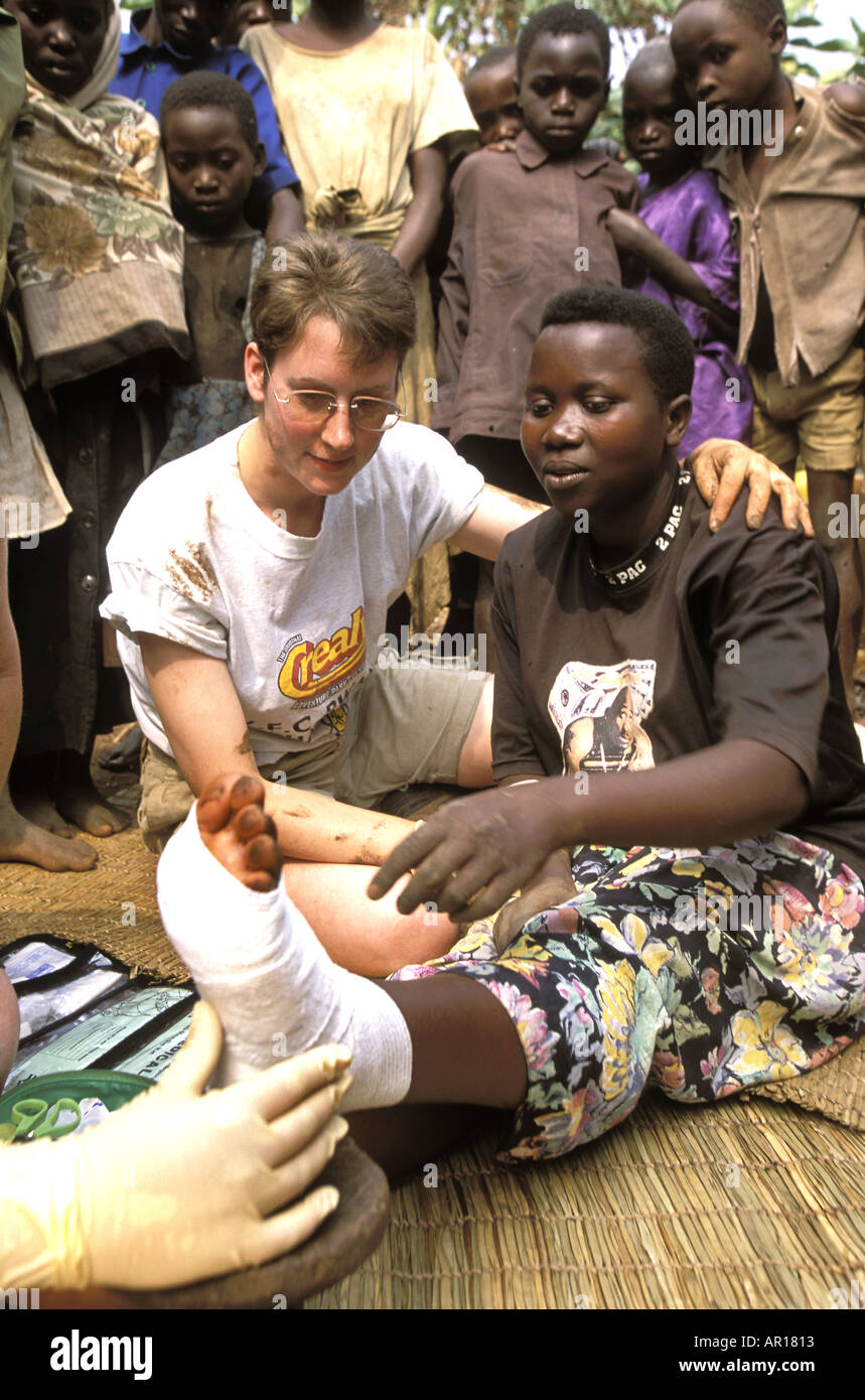 Rwanda Julia from UK Young Farmers gives medical help to genocide orphan Sylvie  Stock Photo