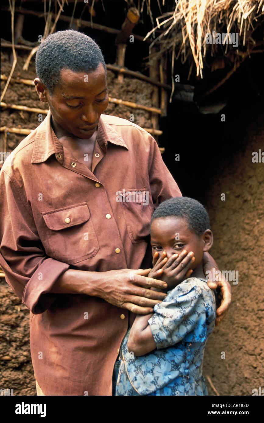 Rwandan genocide orphan Alfonse is mother and father to his younger siblings Stock Photo