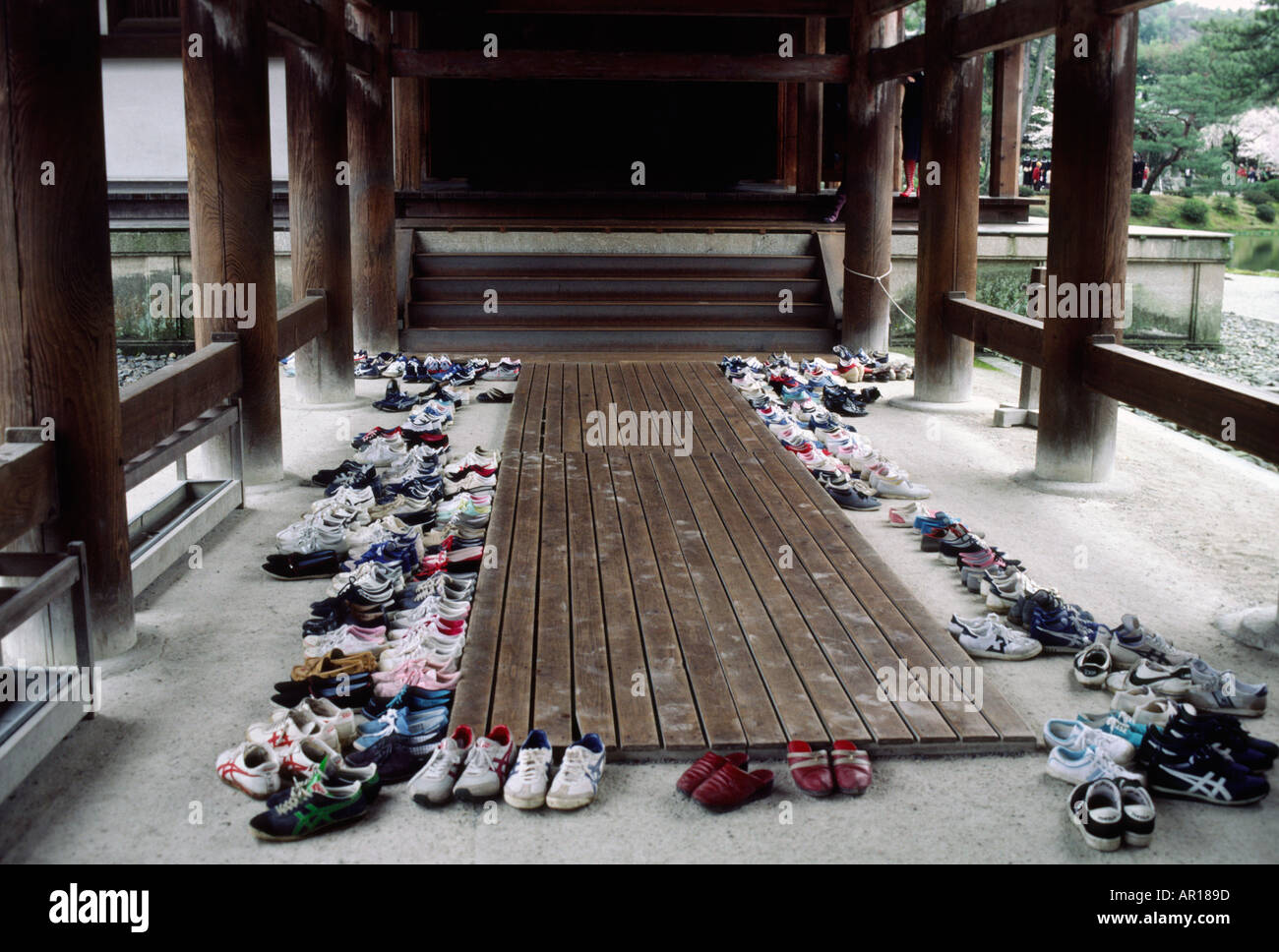 Shoes left at entrance to Kyoto Shrine Stock Photo Alamy
