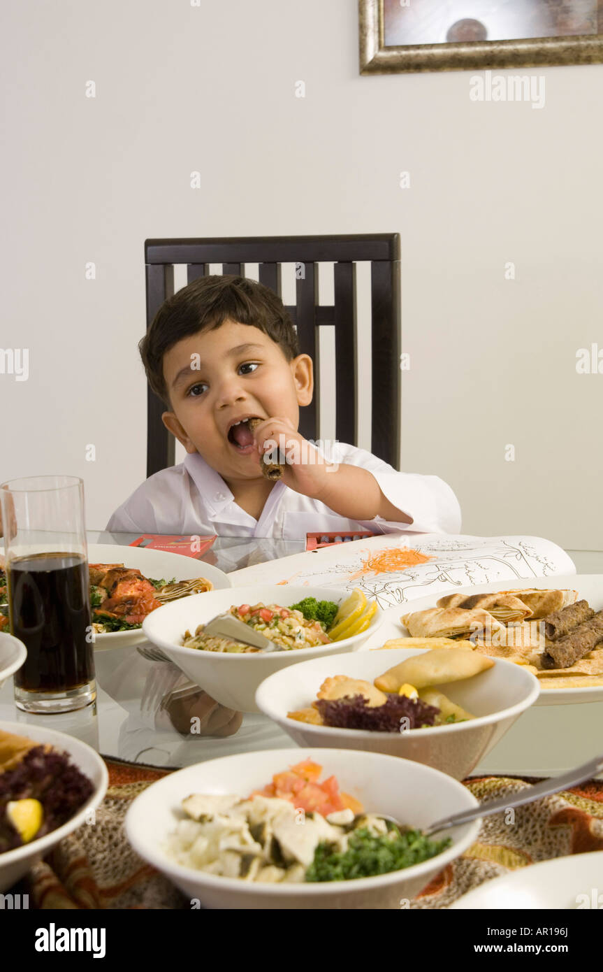 Arabic Boy Traditional Clothing Eating High Resolution Stock Photography And Images Alamy