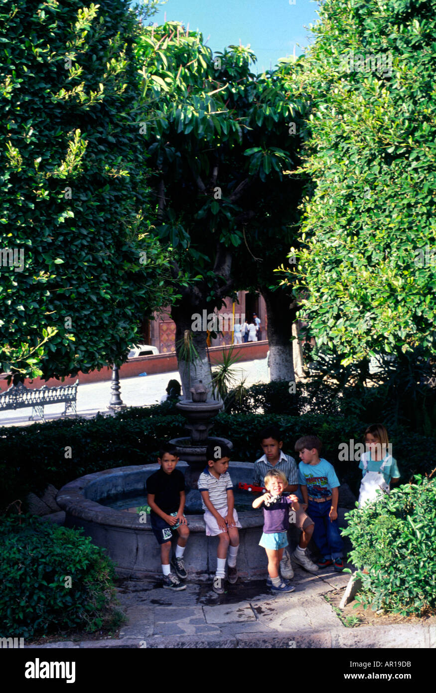 Children playing Le Jardin San Miguel de Allende Mexico Stock Photo