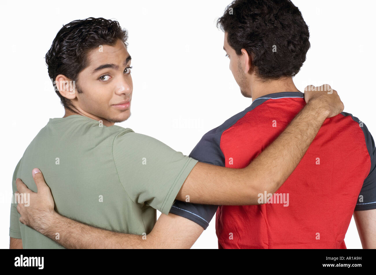 Brothers with arms over shoulder Stock Photo Alamy