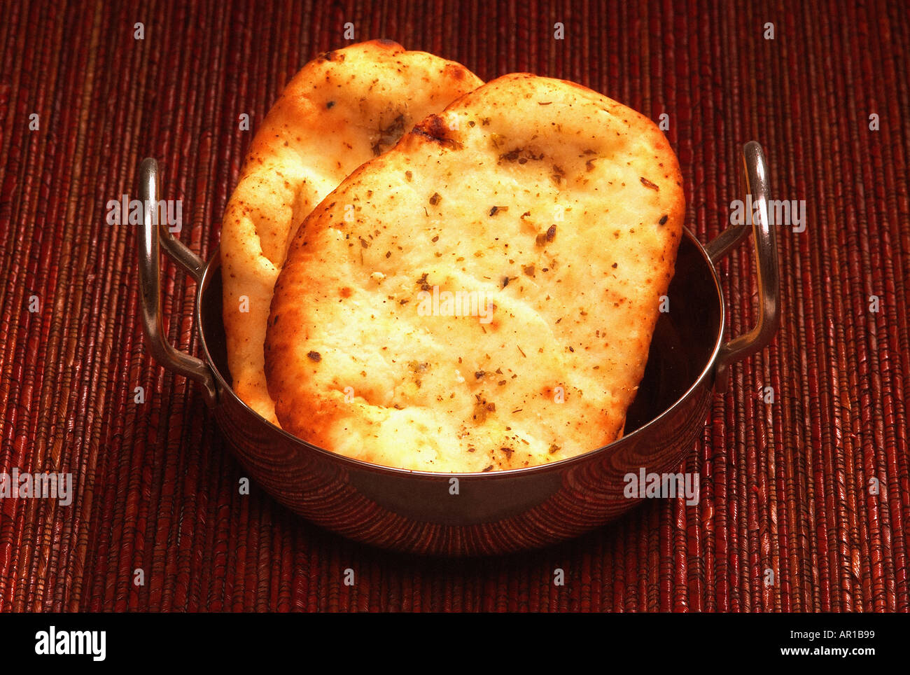 Two nan breads in stainless steel dish Stock Photo Alamy