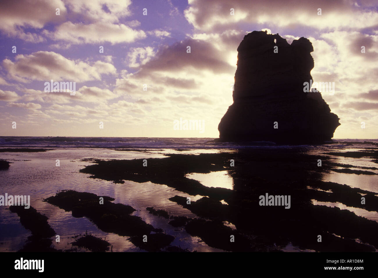 12 Rocks Look Out One of the rocks known as the Twelve Apostles stands silhouetted ...