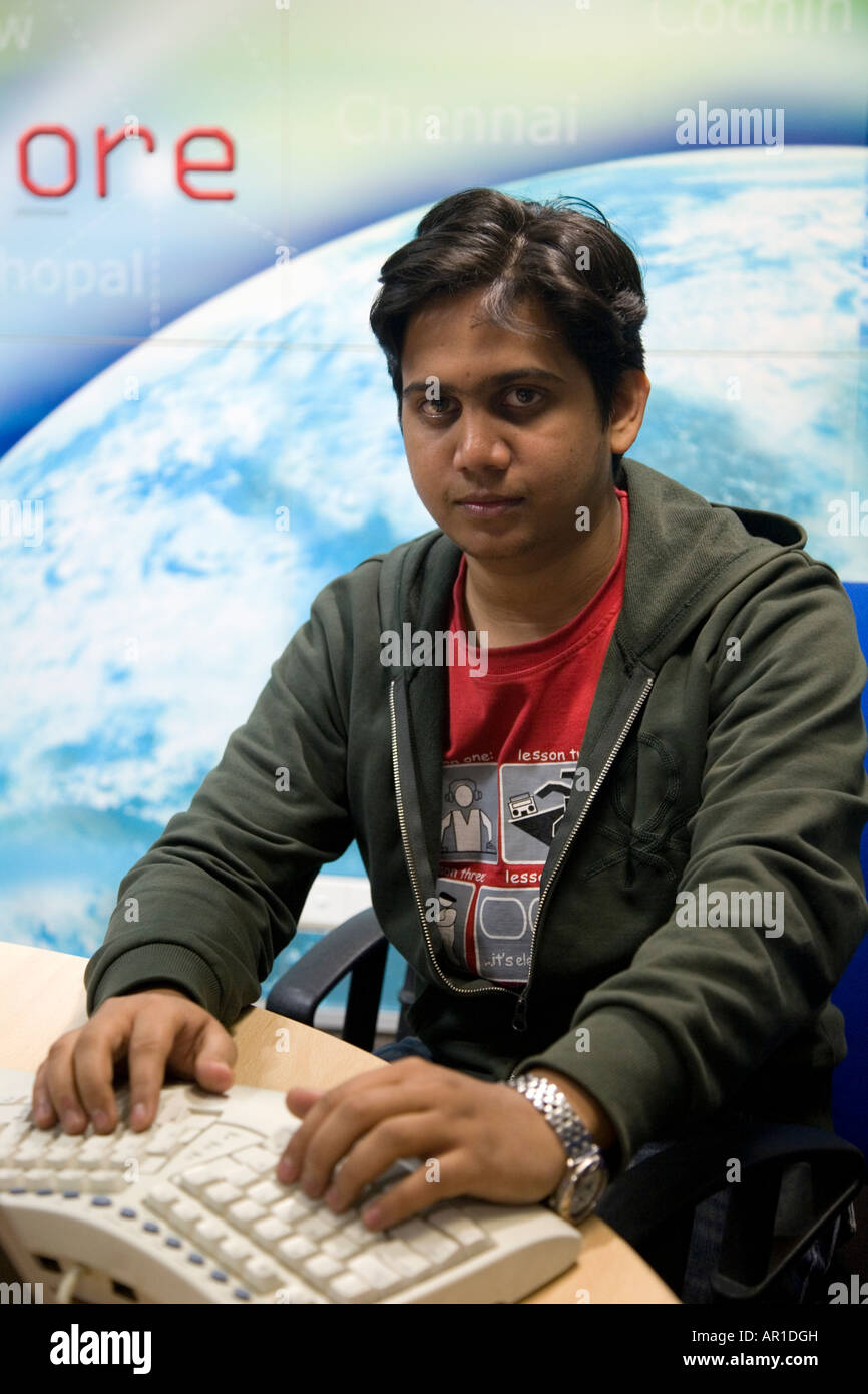 Indian man sits ergonomic keyboard hires stock photography and images