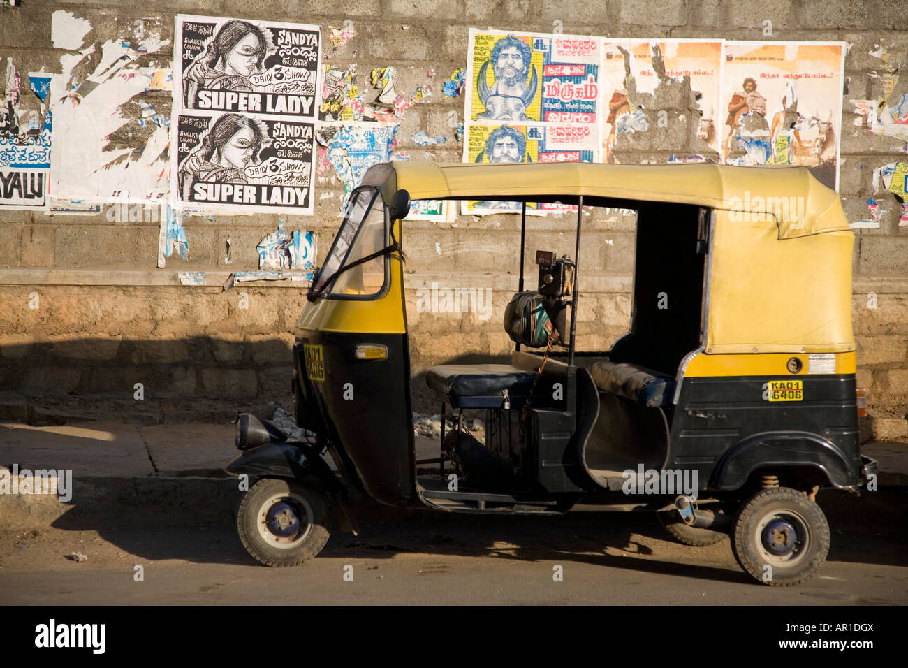A rickshaw stands on a street in Bangalore, India. Stock Photo