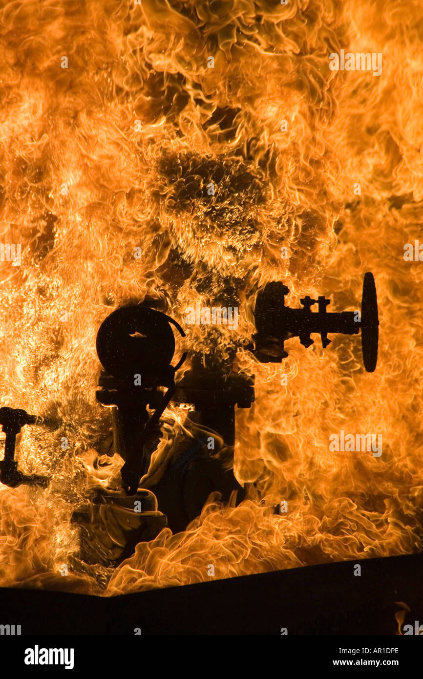 Industrial valve leaking flamable liquid on fire Stock Photo Alamy