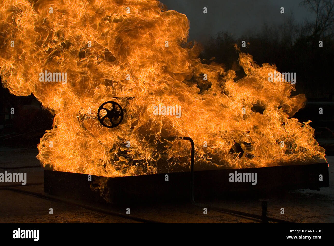 Industrial valve leaking flamable liquid on fire Stock Photo Alamy