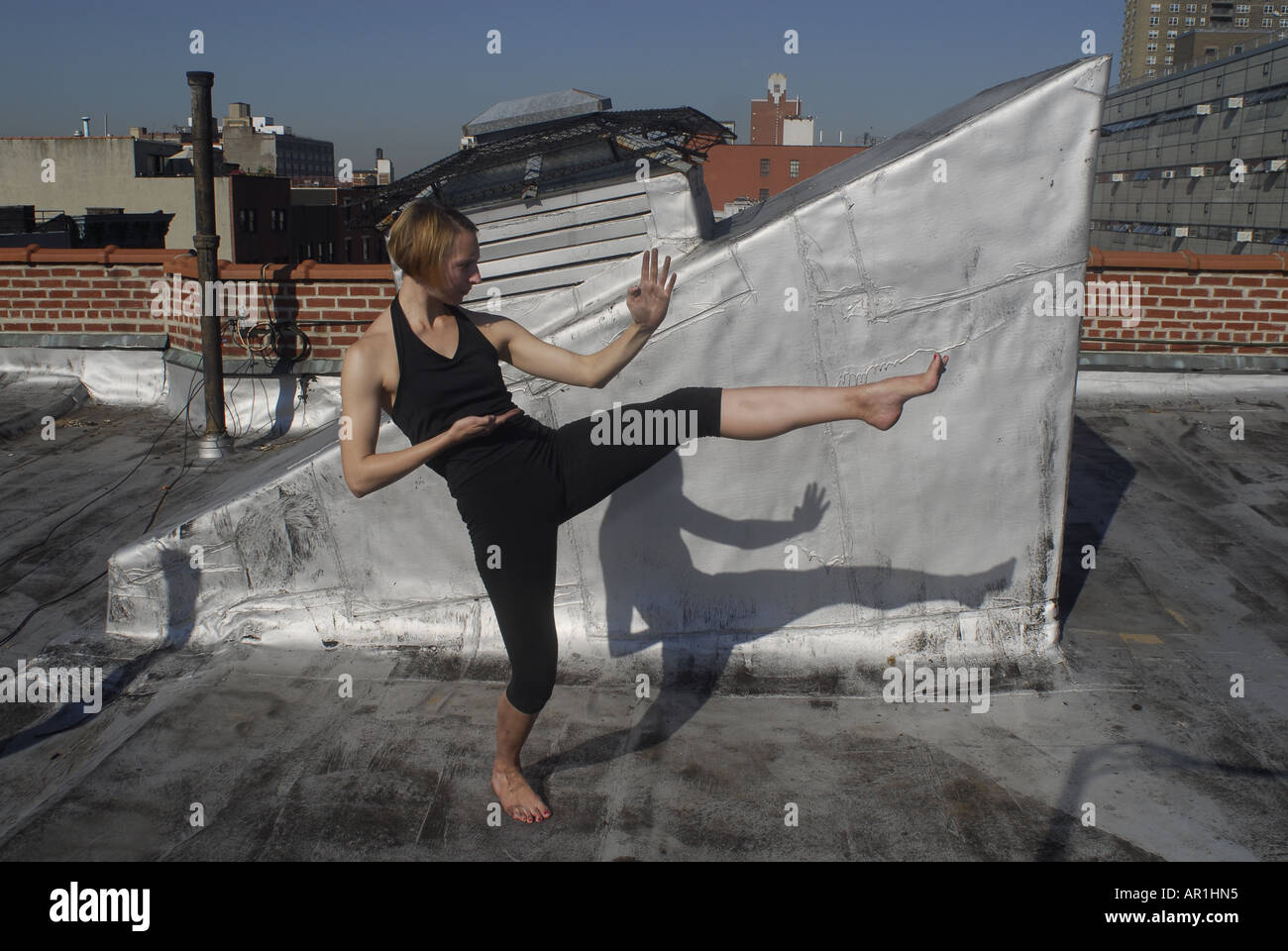 Model released New York CIty Thirty years old blond woman practising karate and martial arts in a sunny morning in mid town Man Stock Photo