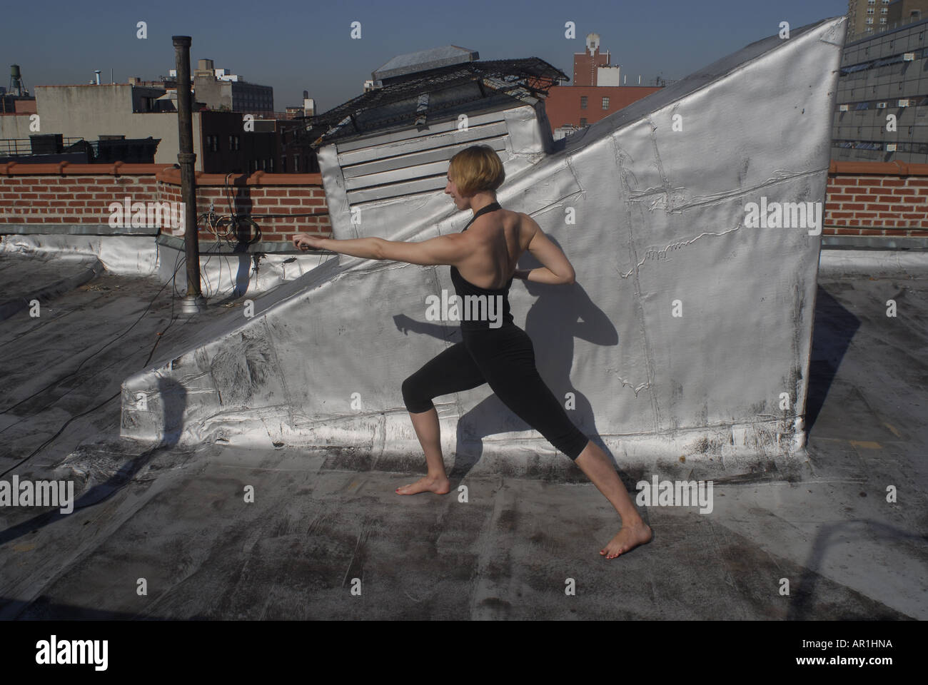Model released New York CIty Thirty years old blond woman practising karate and martial arts in a sunny morning in mid town Manh Stock Photo