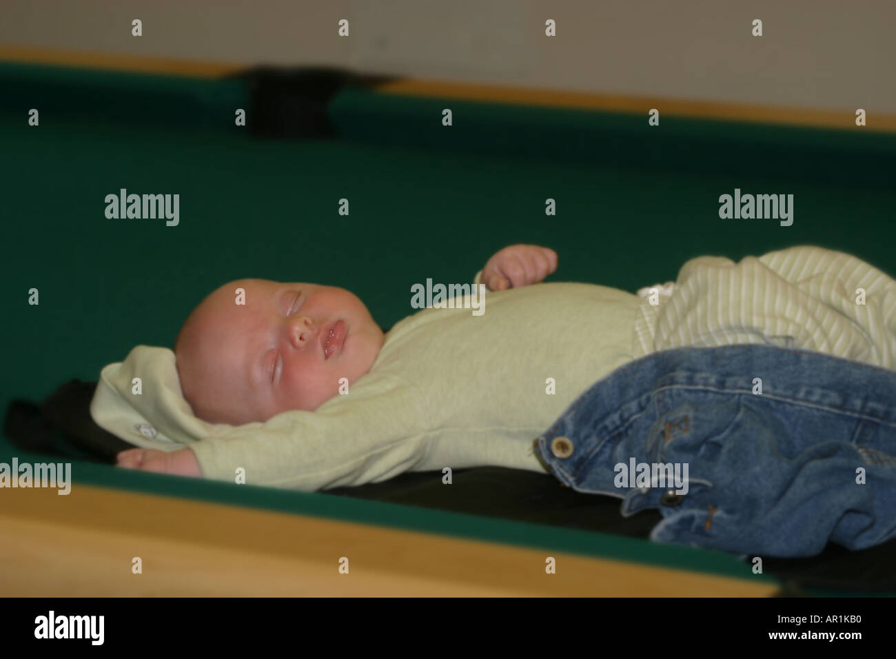 Baby sleeping on pool table hires stock photography and images Alamy