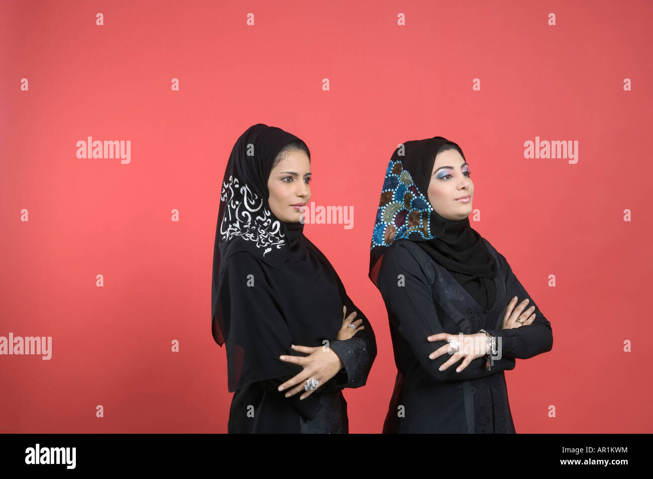 Two Arab Ladies standing with hands folded Stock Photo