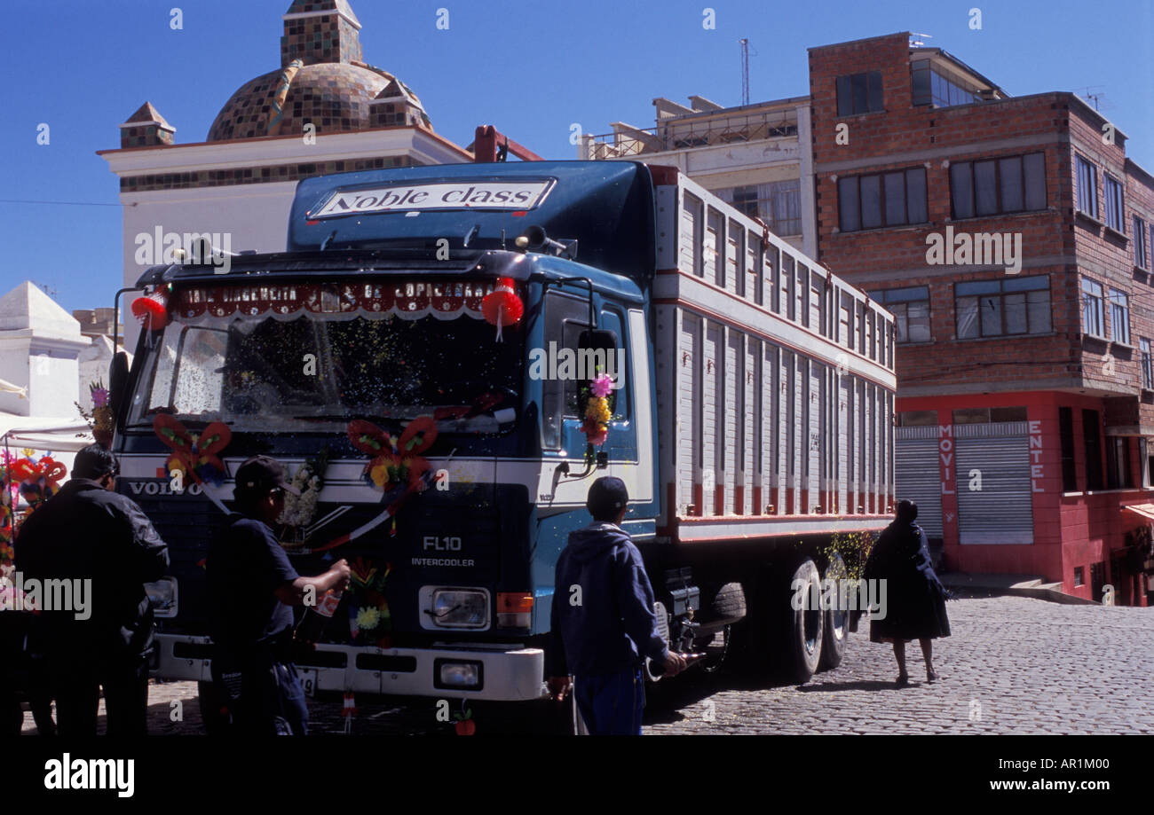 Vehicle is being blessed with flowers beer and coca cola in front of the Cathedral in Copacabana Bolivia Stock Photo