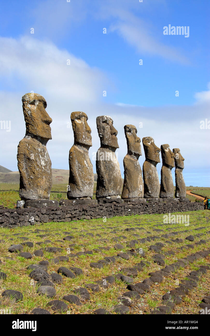 Chile Easter Island rapa nui Ahu Akiva 7 seven moai in row face right with blue sky background on clear day Stock Photo