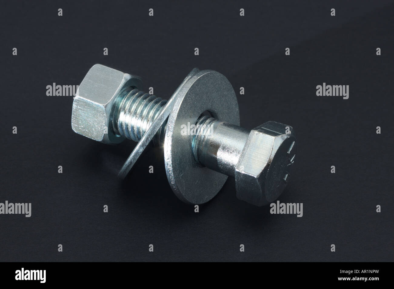 A bolt with washers and nut attached Stock Photo Alamy