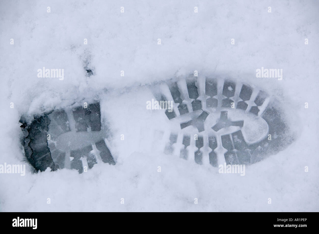 A bootprint in snow Stock Photo