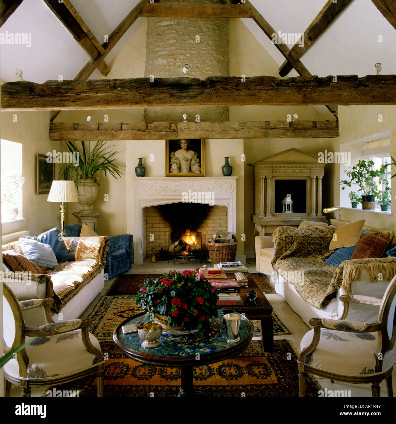 beamed sitting room with fire place in an English country house Stock