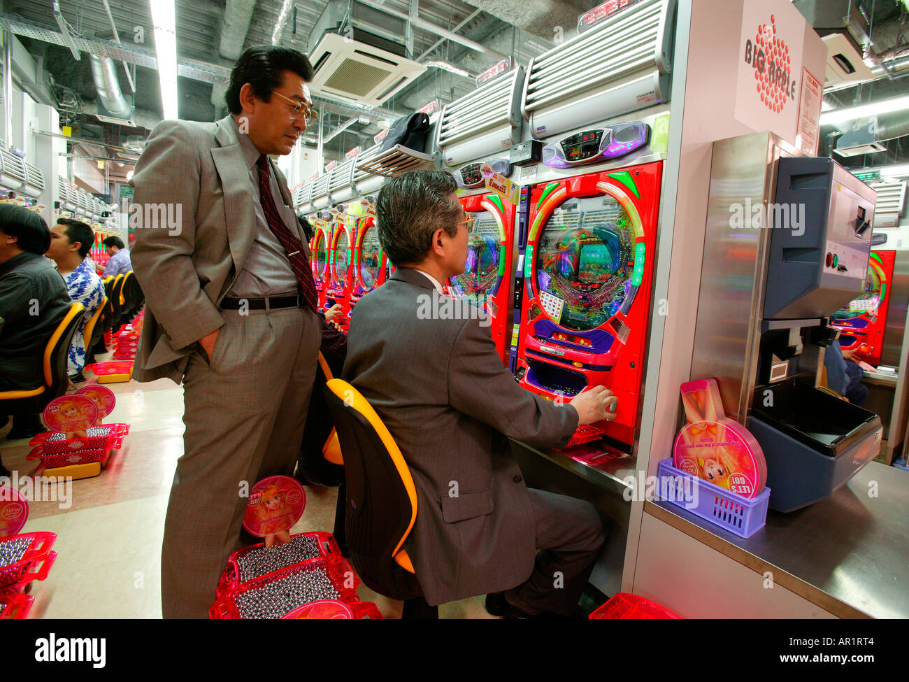 Typical Pachinko Hall with business men, Tokyo Japan Stock Photo