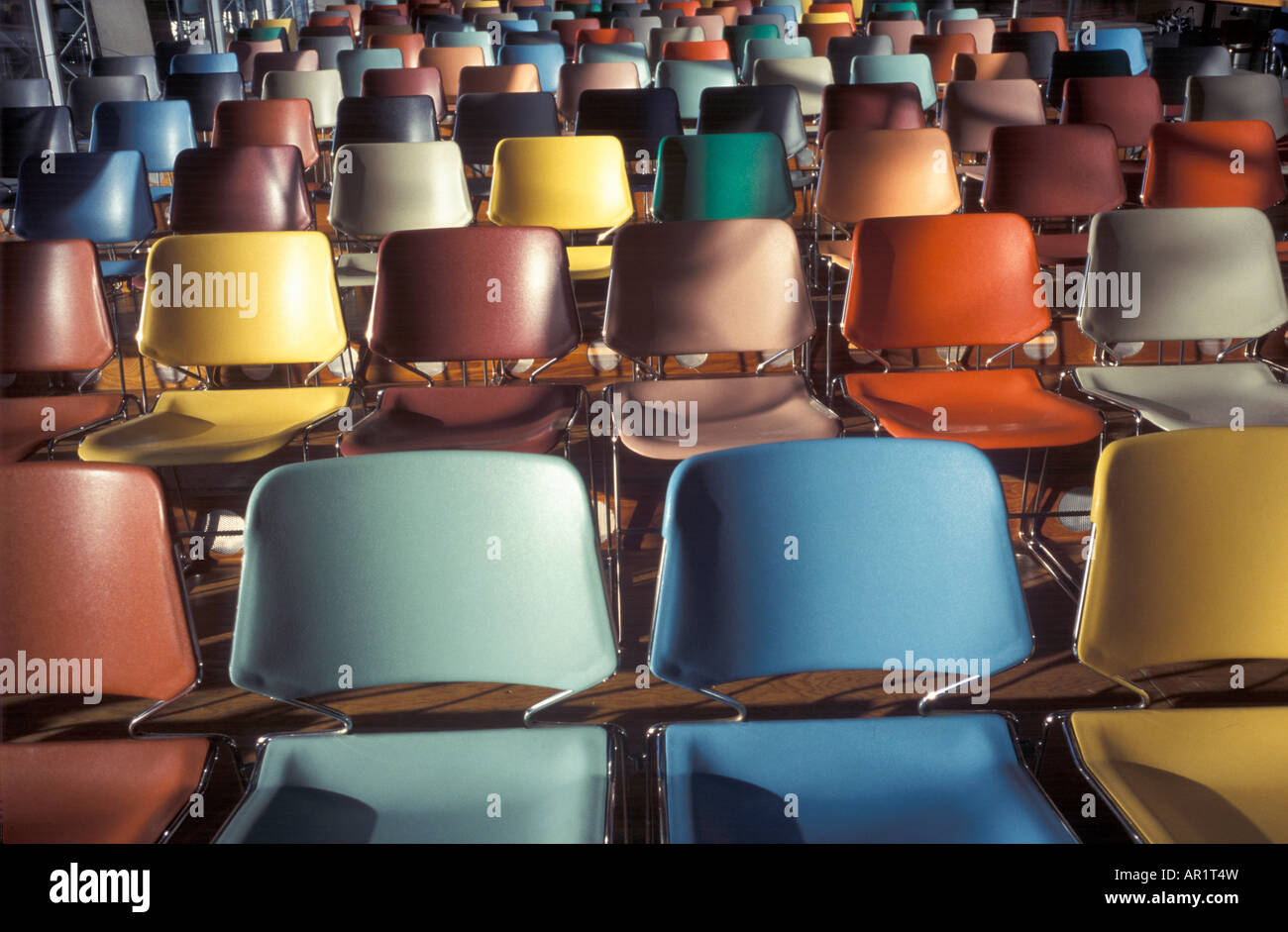 Colored chairs in hall Stock Photo - Alamy