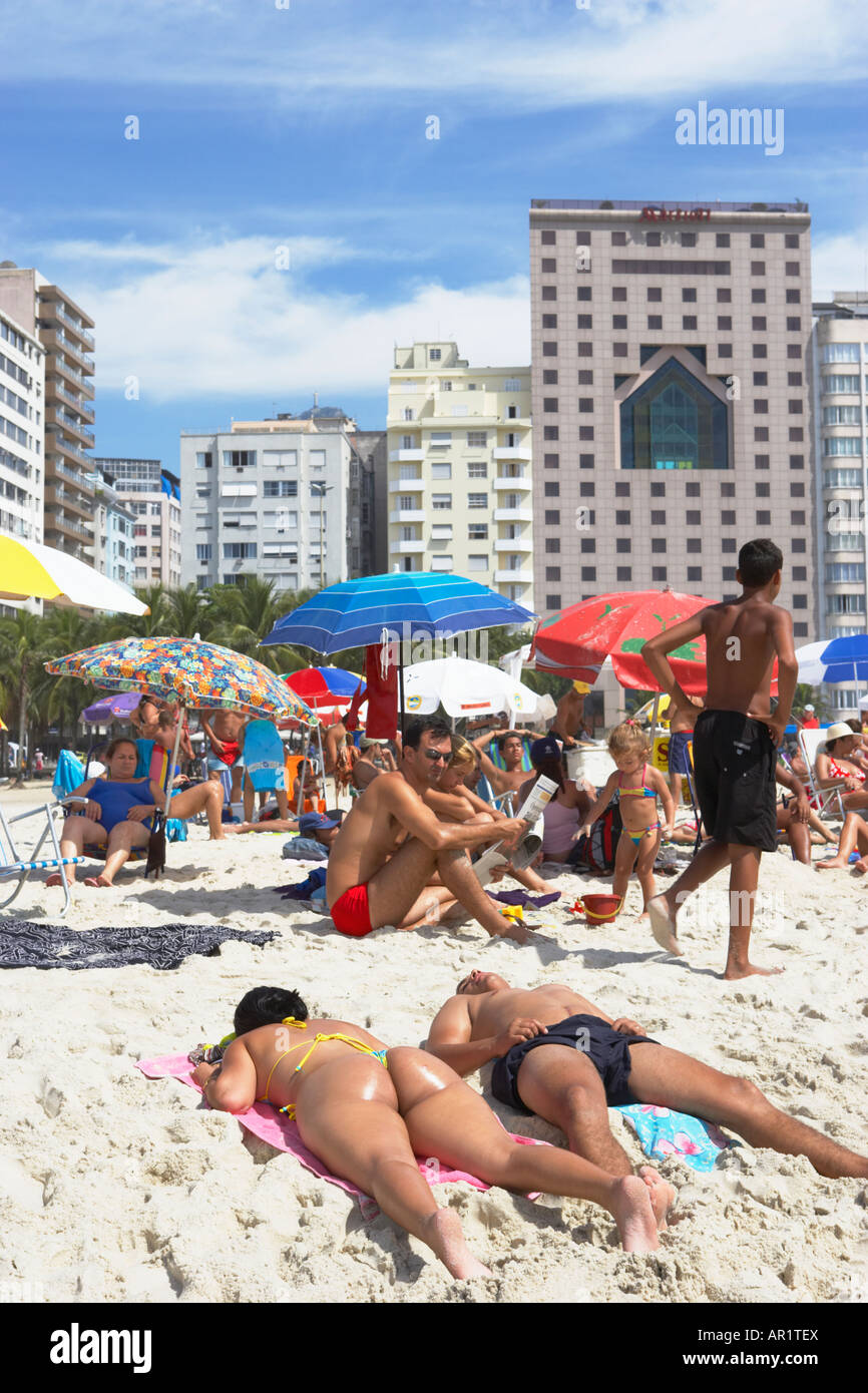 Sunbathers On Copacabana Beach In Rio De Janeiro Brazil
