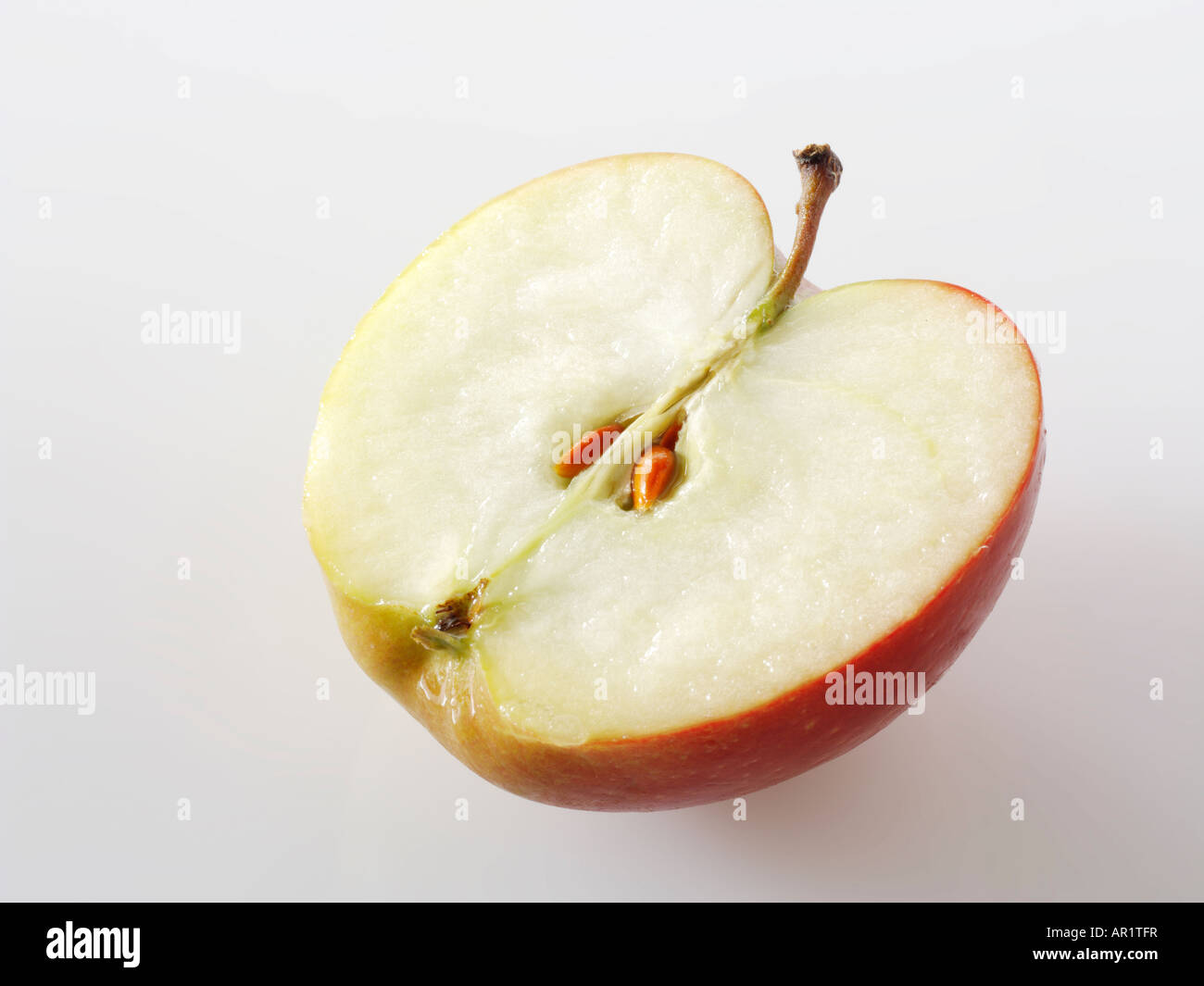 Half an apple with pips - Braeburn Stock Photo