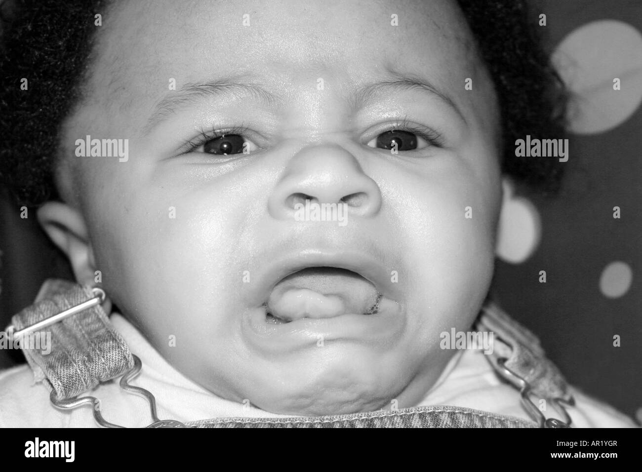 Crying six month old mixed African American - Hispanic boy Stock Photo