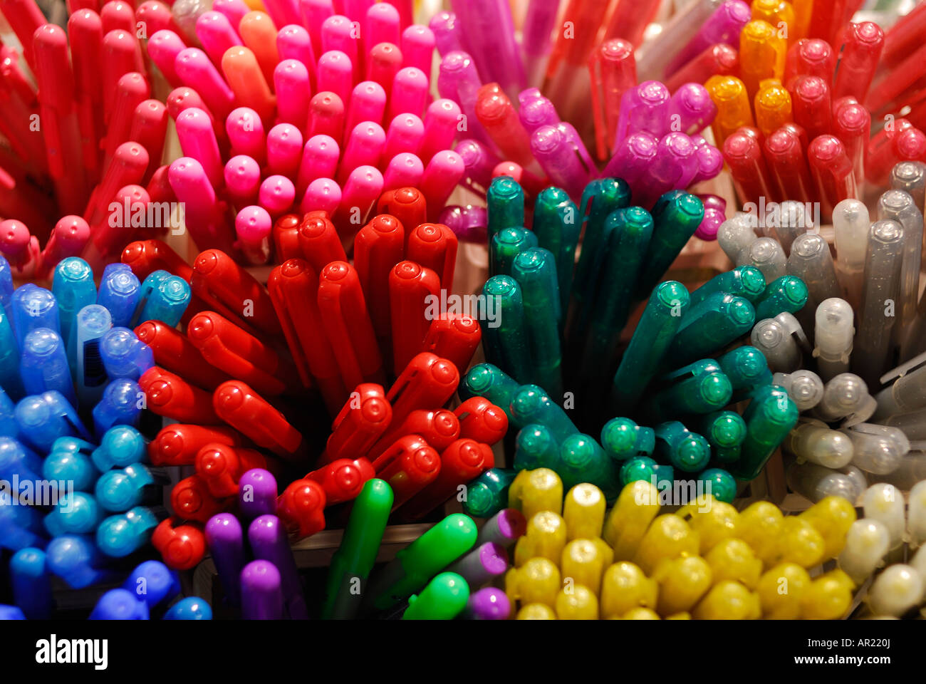 different colours of pens creating a semi abstract composition colours used are red green blue yellow orange and grey Stock Photo