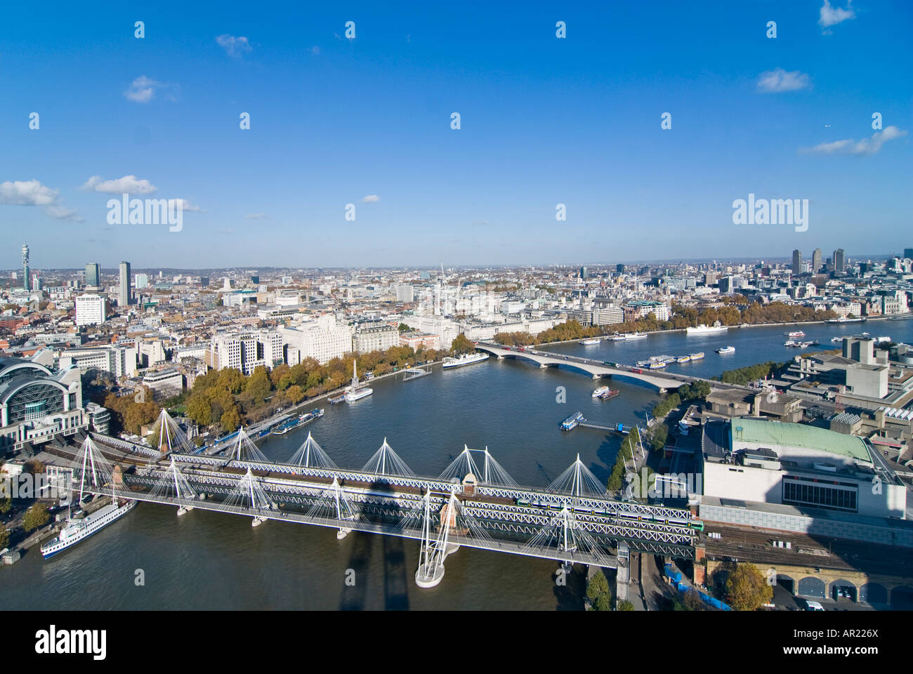 Horizontal wide angle aerial view across the rooftops of central and eastern London on a bright sunny day Stock Photo