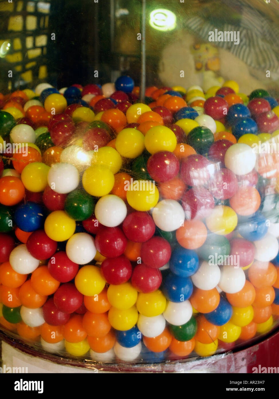 Bubble gum machine selling multi coloured balls of containg chewing gum and sweets Barcelona Spain Stock Photo