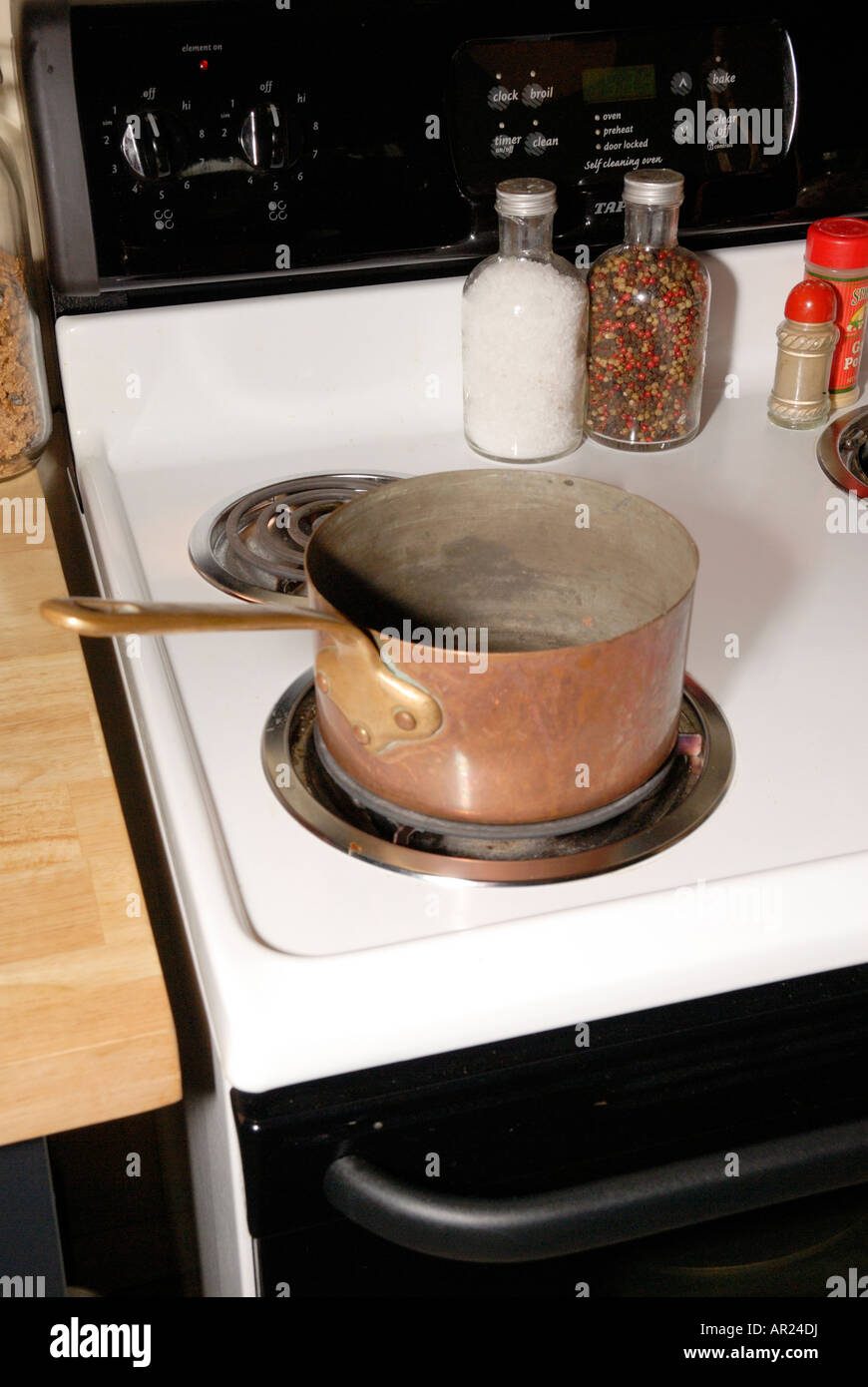 copper pot on stove Stock Photo Alamy