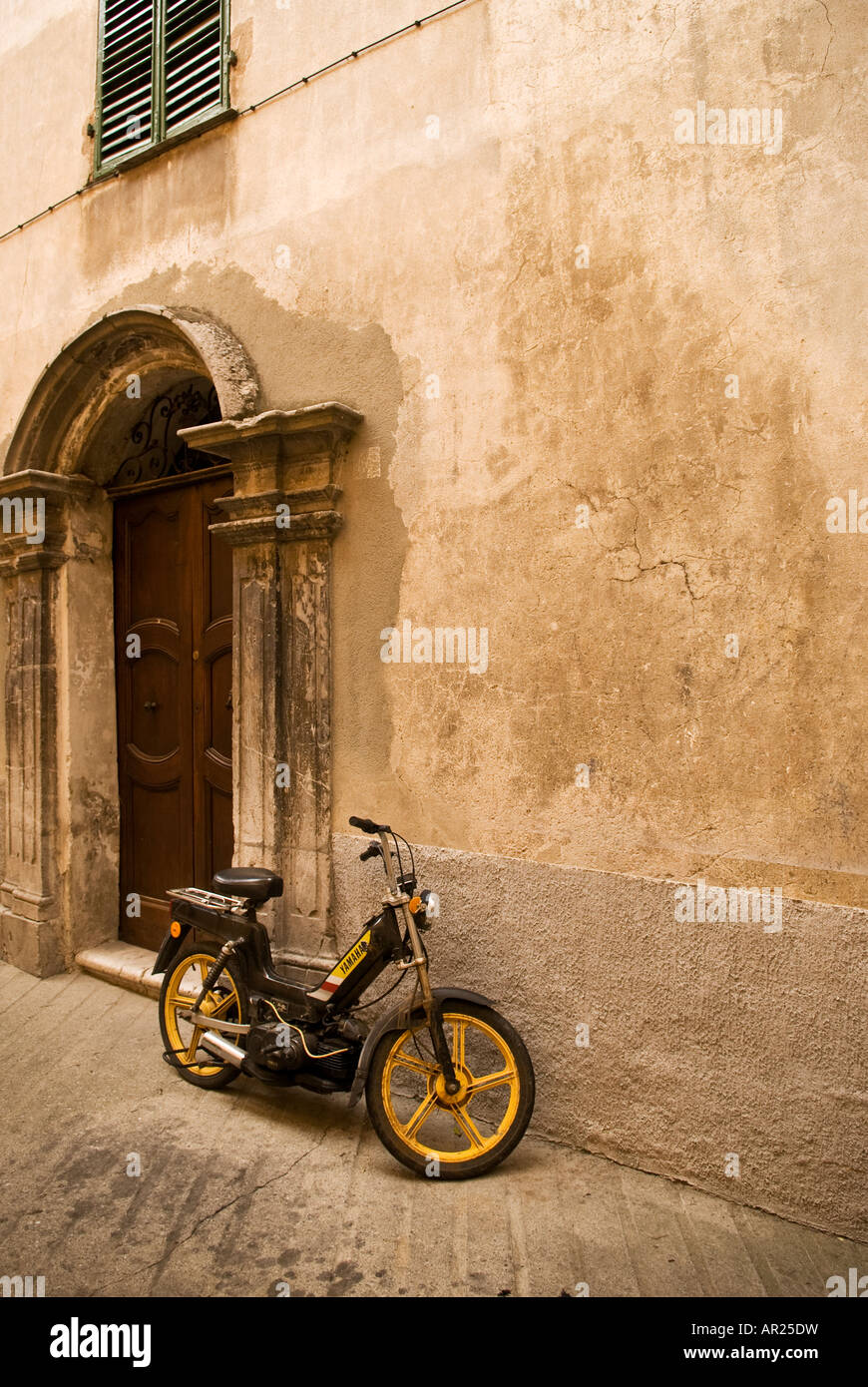 Moped parked outside building, Sospel, Alpes-Maritimes, France Stock Photo