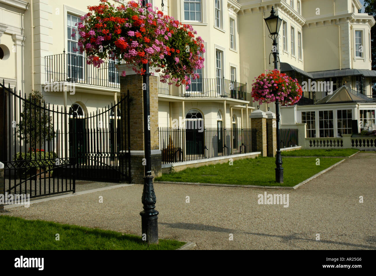 White buildings and flowers on the waterfront at Richmond upon Thames Surrey England Stock Photo