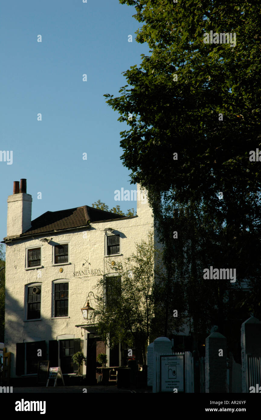 Spaniards Inn dwarfed by trees on the edge of Hampstead Heath Highgate London England Stock Photo