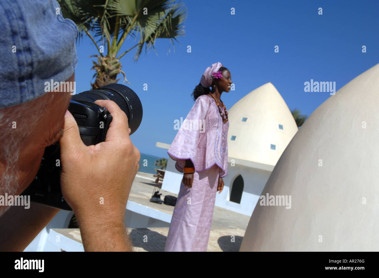 Travel photographer at work on location in Africa Stock Photo