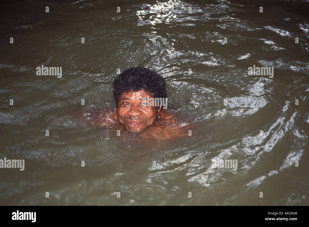 Ecuadorian man swimming in the Amazon River Ecuador South America Stock