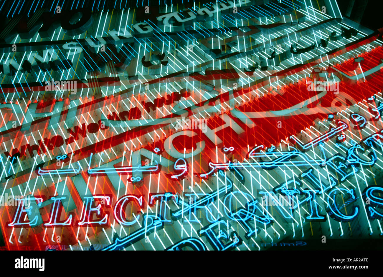 UAE Dubai Neon signs in Al Fahidi Street electronics shopping area at