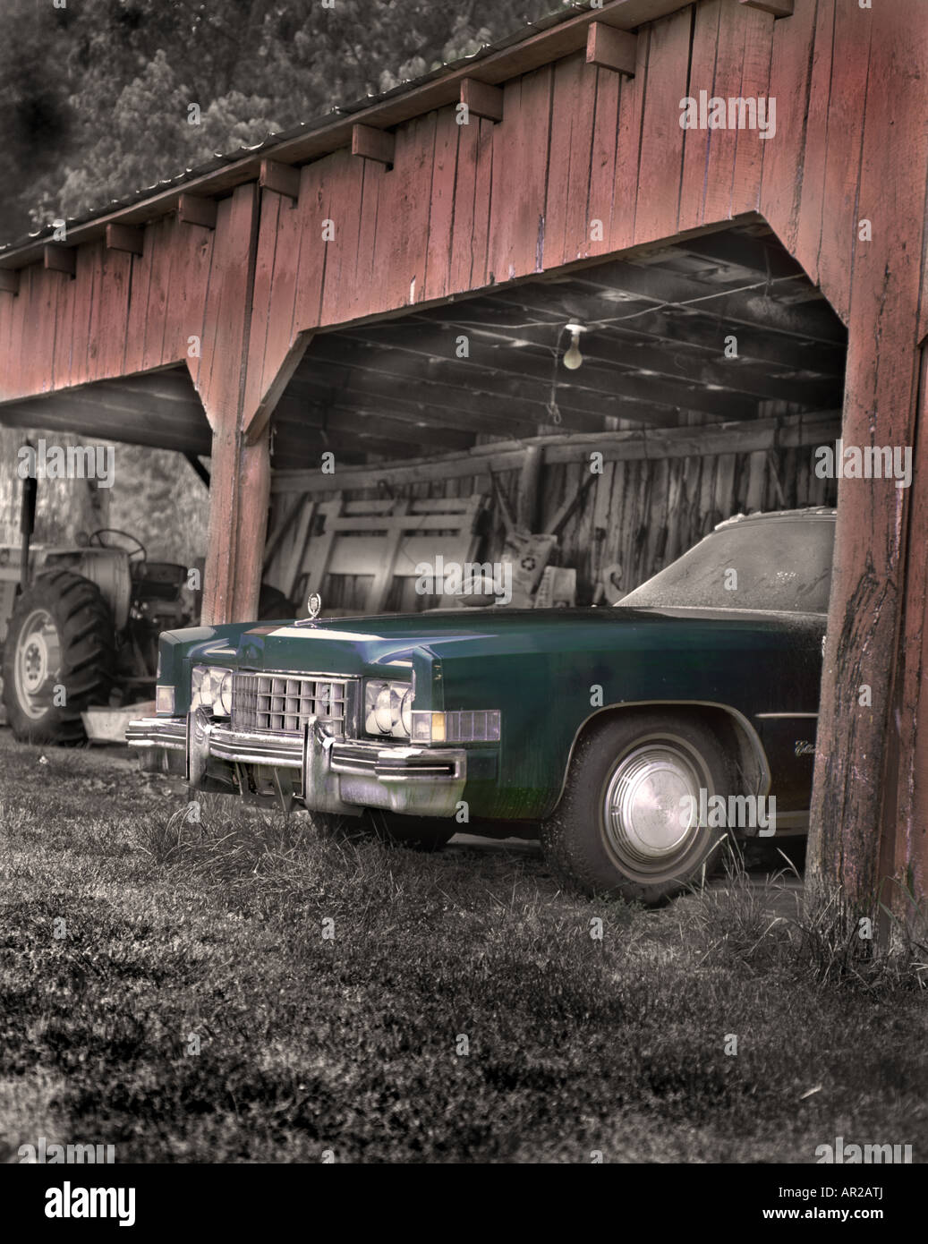 green Cadillac parked in a red barn Stock Photo