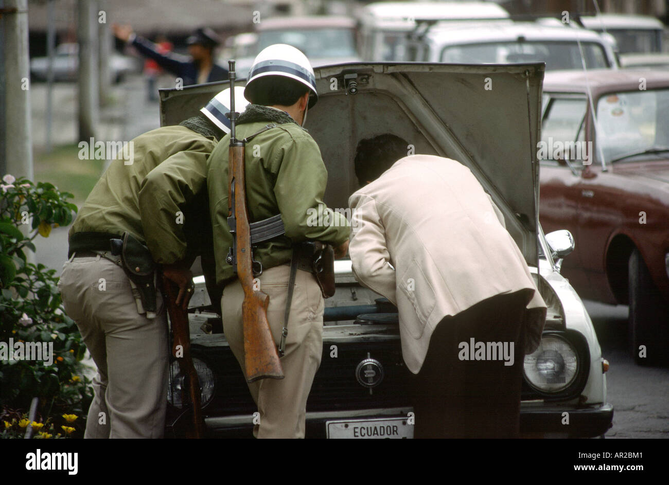 Ecuador Quito security armed police examining car Stock Photo