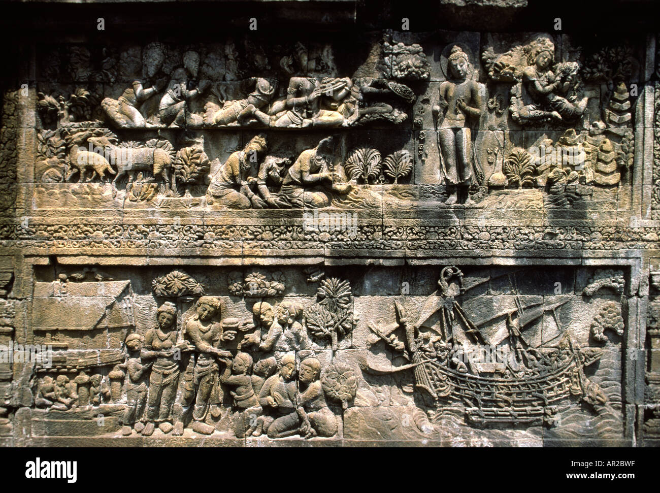 Indonesia Java Borobudur largest Buddhist temple in Indonesia carved stone panel showing colonial era ship Stock Photo