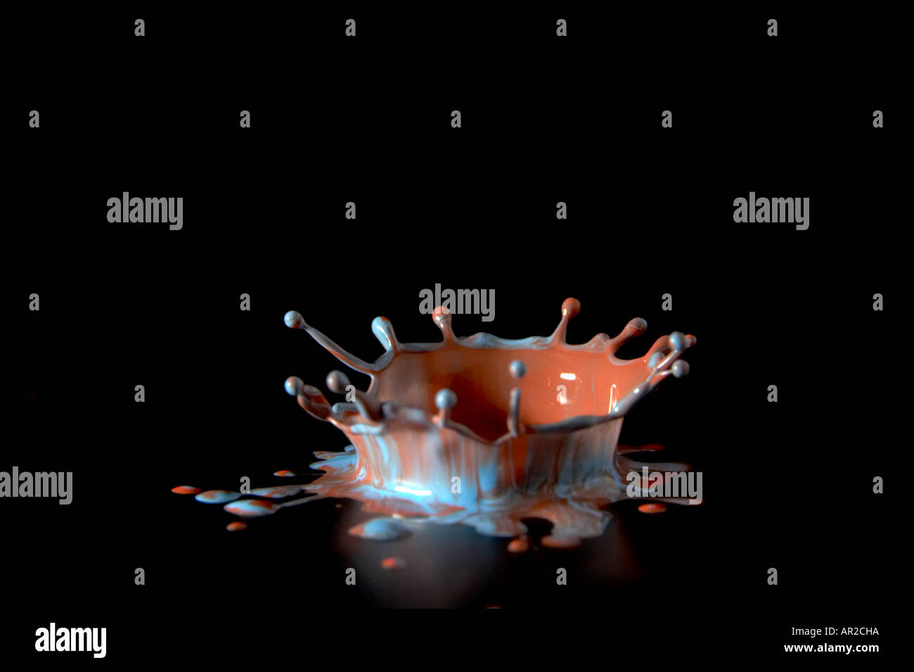 Splash of color, paint droplets on a black background Stock Photo - Alamy