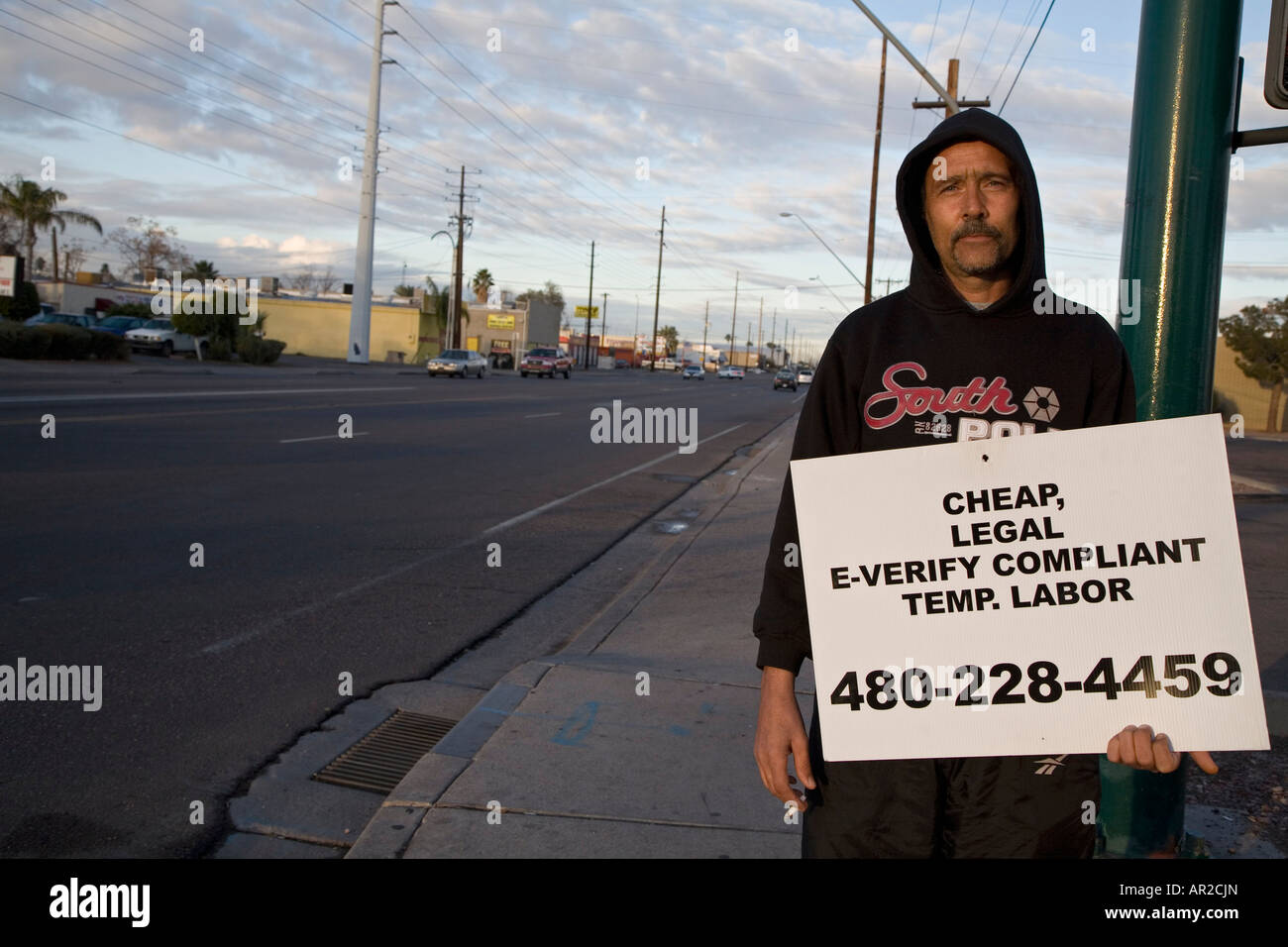 Temporary labor employer advertises that he provides cheap, legal workers Stock Photo