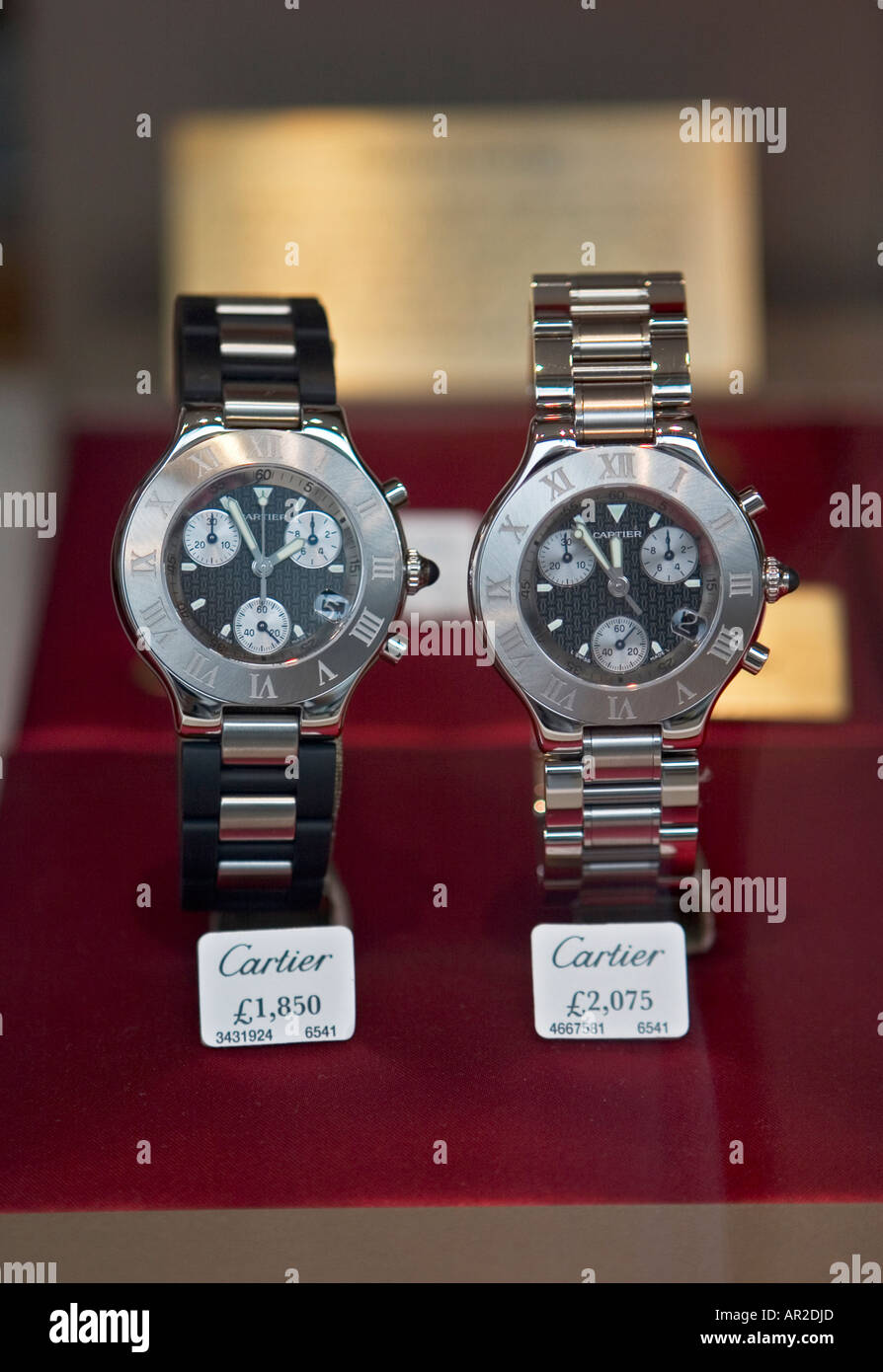 Close up of two Cartier watches in Watches of Switzerland store window