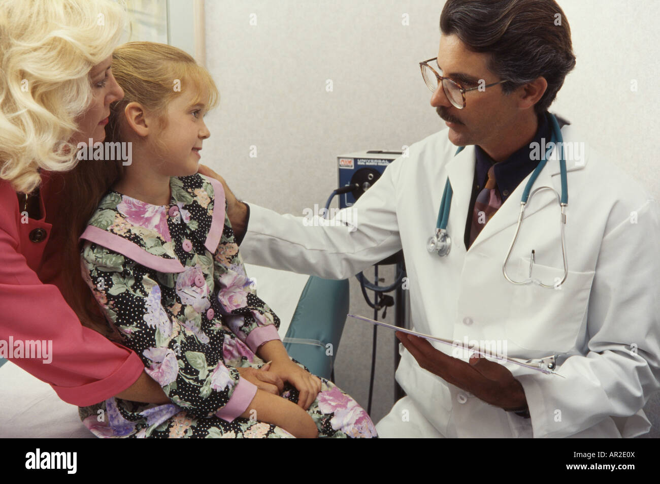 Doctor and young playful patient, physical exam, Miami Stock Photo