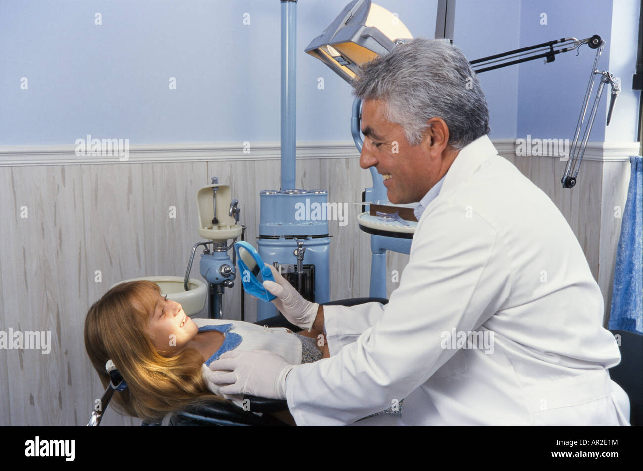 Dentist and young patient, having dental exam, Miami Stock Photo Alamy