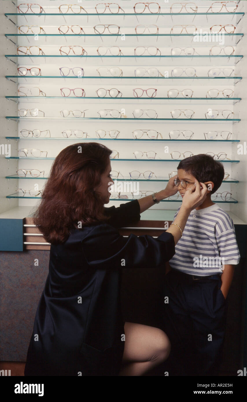 Optometrist giving eye exam, Miami Stock Photo Alamy