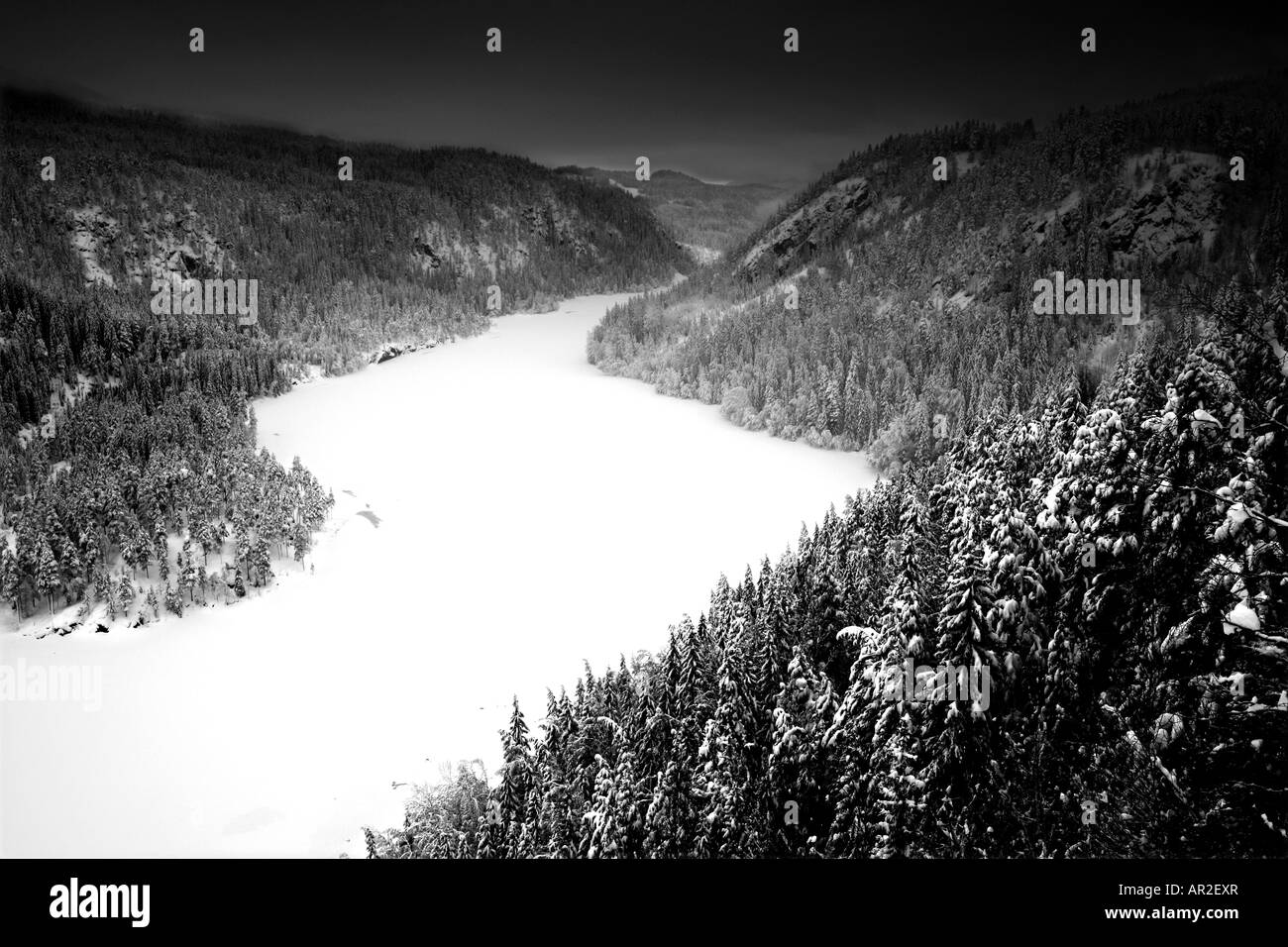 Snowy winter landscape with dark skies, in Aurdal valley, Valdres, Norway. Stock Photo