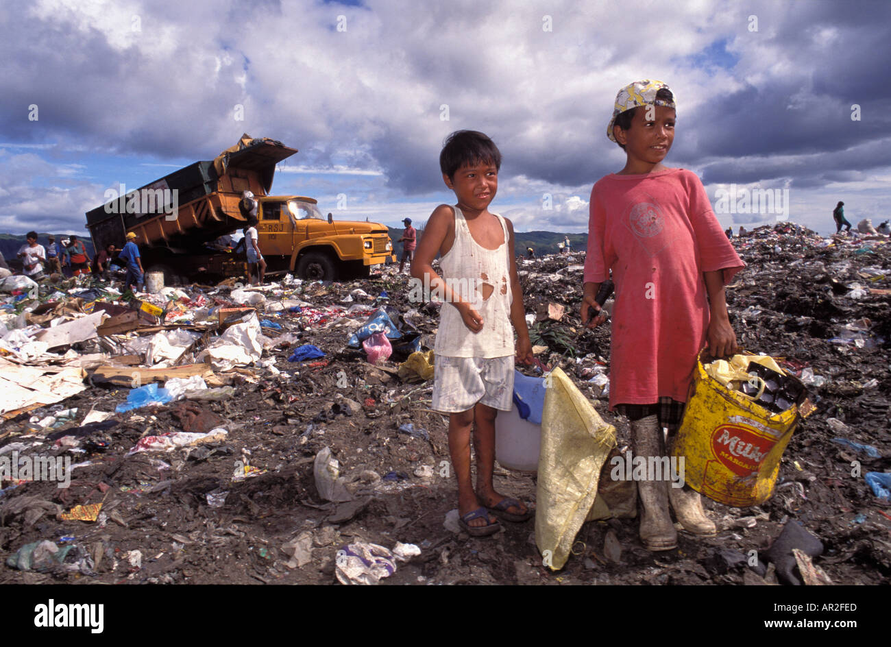 Kids gathering useful rubbish from the city dump Manila Philippines