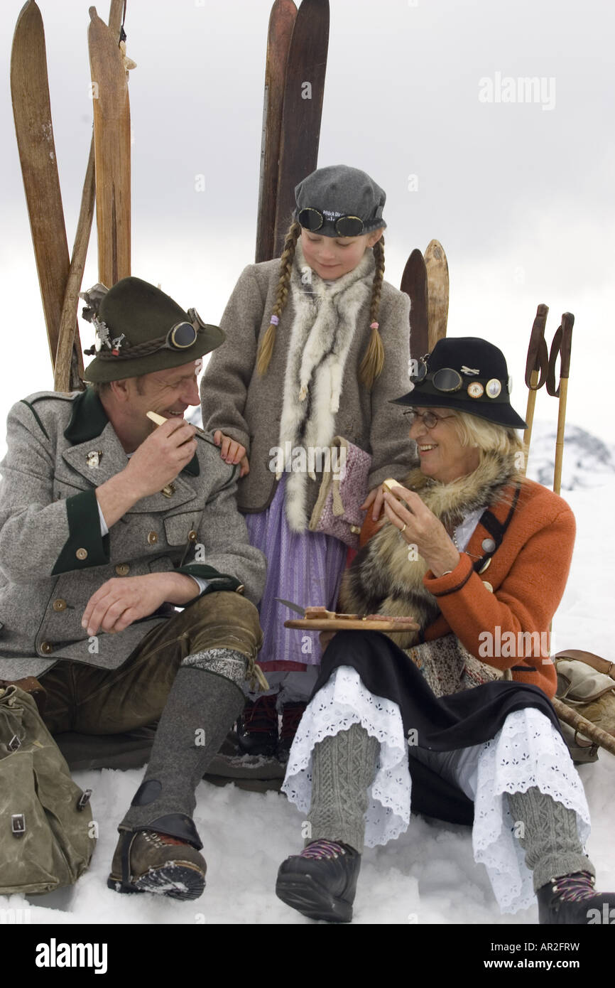 familiy with out-dated clothing on a ski trip having a break, Austria Stock Photo